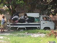 mini-truck that collects dry garbage three times a week